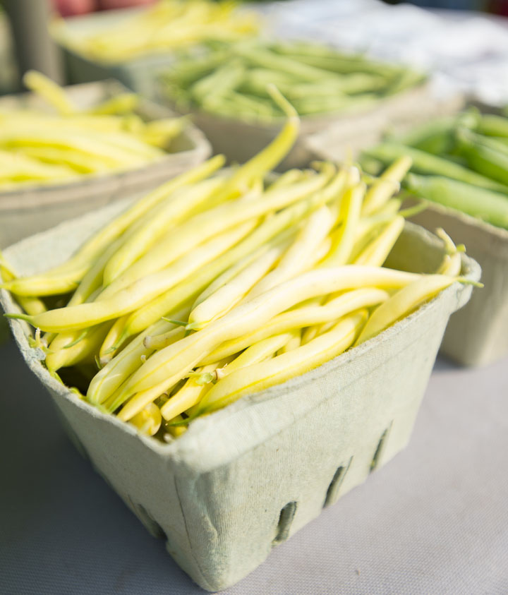 basket of yellow beans at a farmers' market