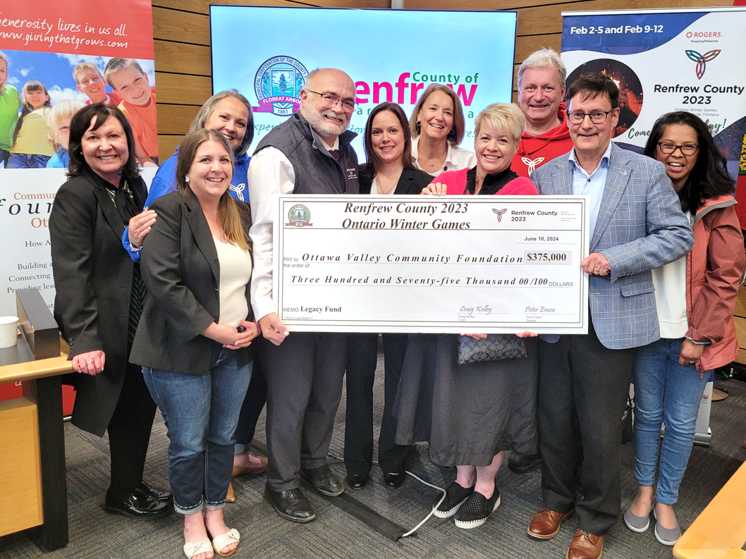 Group of people with large cheque - cheque presentation for Ontario Winter Games Legacy Fund 